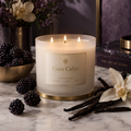 Cora Cabre 3-Wick Candle – Blackberry Vanilla, branded luxury candle jar with blackberries and vanilla pods